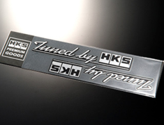 Universal - HKS STICKER tuned by - Size: 190 x 35mm (x2) - Colour: Black (brushed) - 51003-AK117