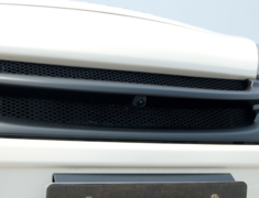 Note - E12 - Front Grill - For cars with front mounted cameras - Construction: FRP - Colour: EAK: Beat Nick Gold - Colour: K23: Brilliant Silver - Colour: KAD: Dark Metal Gray - Colour: KH3: Super Black - Colour: LAE: Aurora Move - Colour: NAH: Radiant Tread - Colour: QAB: Brilliant White Pearl - Colour: RBE: Sonic Blue - BCIE12-FG2P