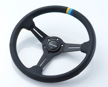 Universal - Standard Edition - Material: Black leather & Black anodized - Color: Black - Diameter: 340mm - Stitch: Yellow/Teal/Navy - 16600001