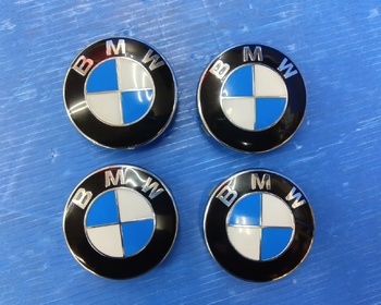 BMW - BMW genuine center caps x 4 (68mm)