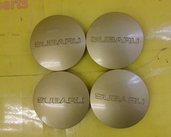 Subaru - 4 center caps for Subaru wheels Gold